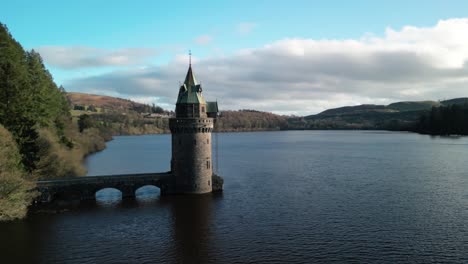 lake vyrnwy straining tower drone anti-clockwise rotate and move in on a crisp, calm, sunny winter afternoon - wales, uk