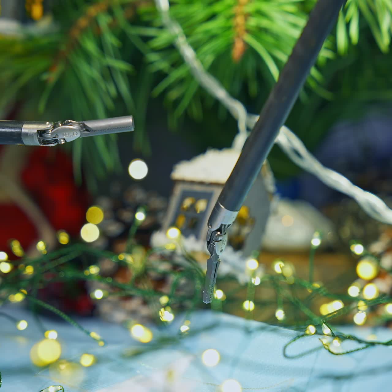 Gadget humanoid decorating Christmas tree while preparing to the holidays. Cropped view. Future technologies concept