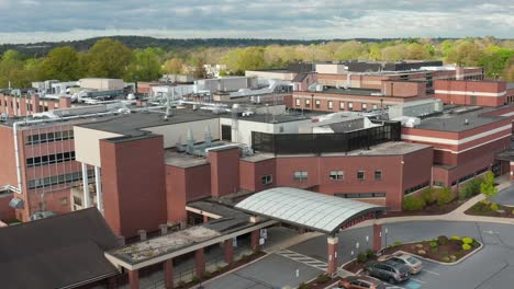 Cinematic-approach-of-Emergency-Room-entrance-at-red-brick-hospital-in-USA