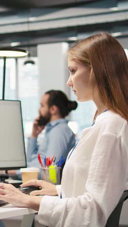 vertical video female technician using ai llm chatbot to automate tasks in office