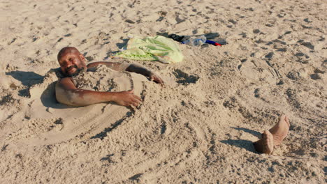 funny man covered in sand on beach enjoying summertime having fun relaxing on warm sunny day 4k