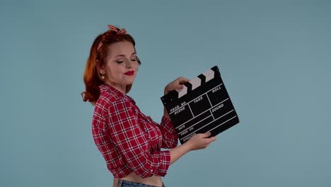 pin-up girl with clapperboard