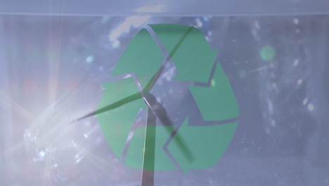 animación de un cartel de reciclaje verde sobre una caja con cajas de plástico y turbina eólica