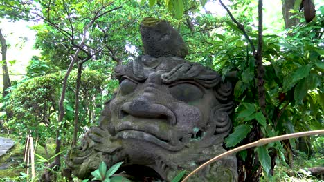 stone figure on japanese garden