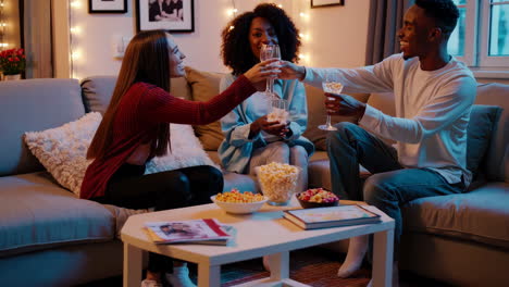 friends toasting and enjoying a cozy evening at home