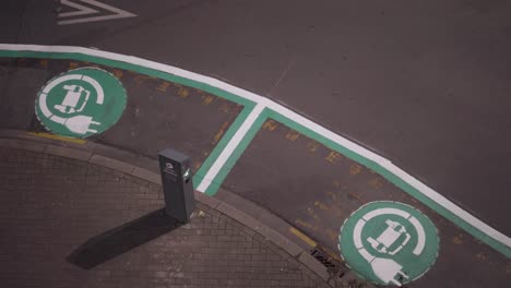 freshly painted electric car charging port on the street - top view