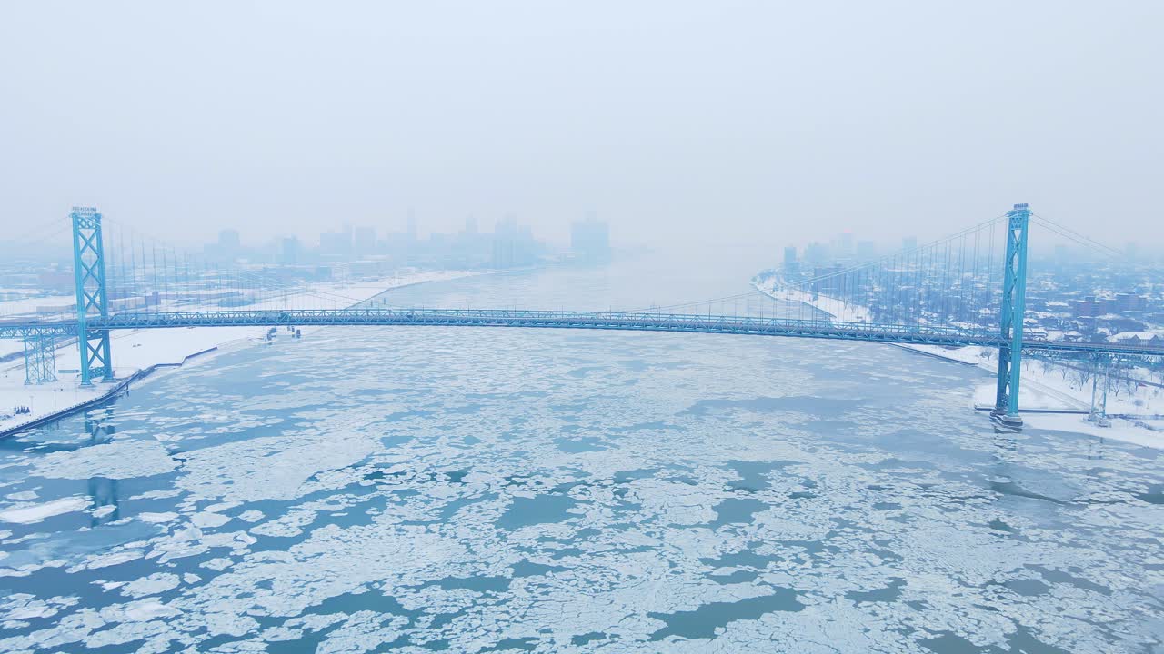 Frozen river under Ambassador Bridge connecting Detroit and Windsor