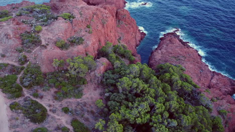 a beautiful aerial landscape of the coast of france and the golden island at sunset