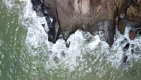 Aerial-Top-Down-Birds-Eye-View-Of-Generic-Ocean-Waves-Crashing-On-Rocks