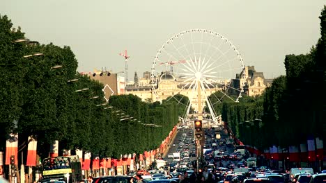 timelapse of traffic on champs elysee and observation wheel in paris, francel in paris, france