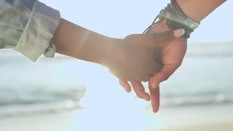 Beach-water,-holding-hands-and-couple-relax