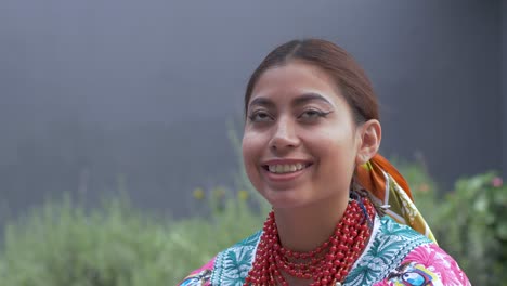 Cinematic-slow-motion-closeup-portraitt-clip-of-a-happy-young-latin-girl-looking-at-the-camera-and-smiling