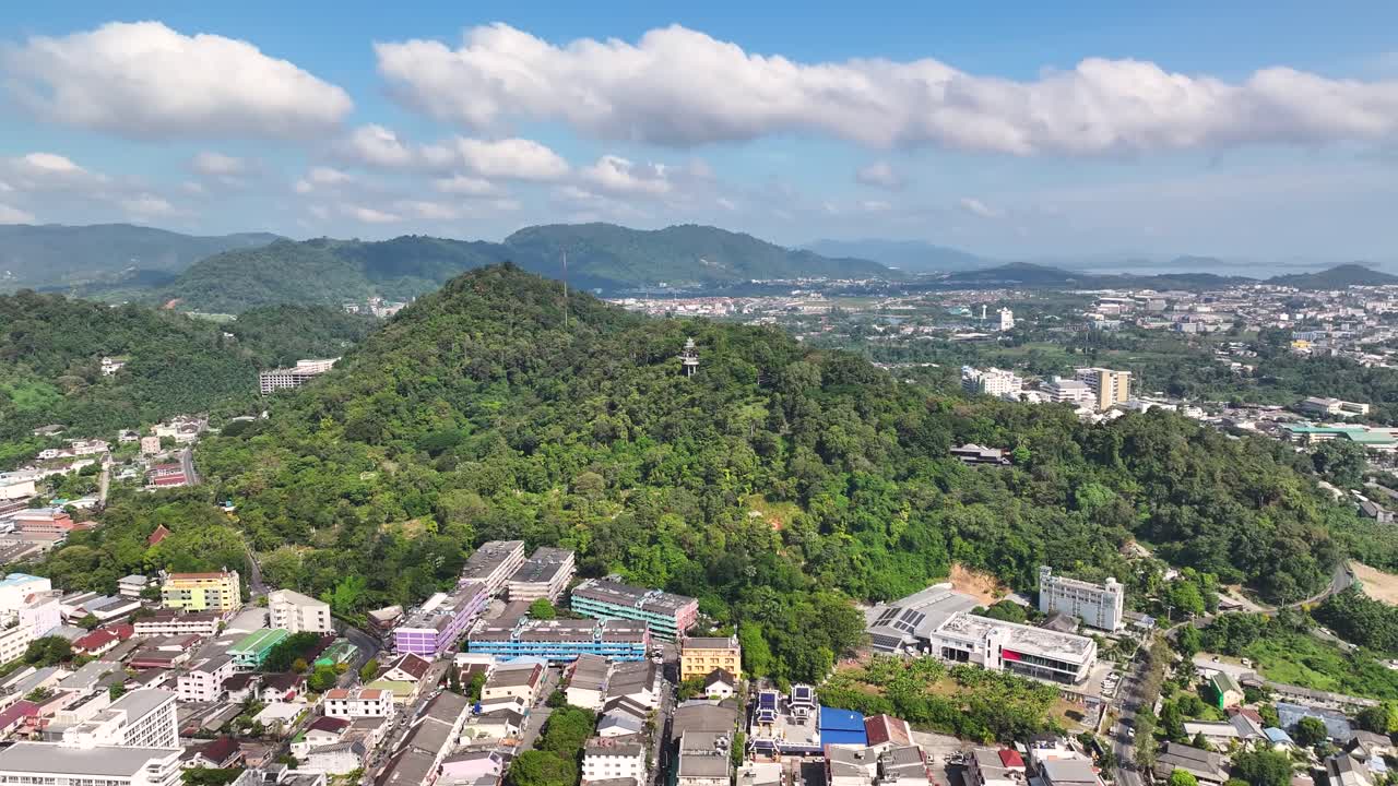 Aerial around Round Hill in Phuket, drone cityscape. Popular tourist destination in Thailand.