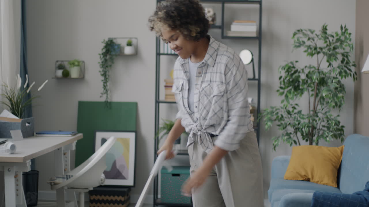Woman Mopping the Floor at Home