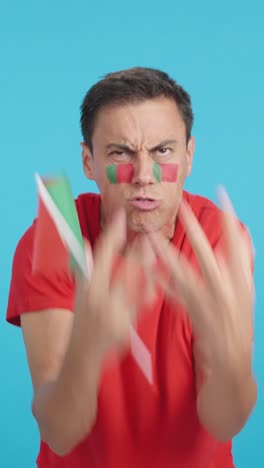 man cheering for portugal, angry with the decision of referee