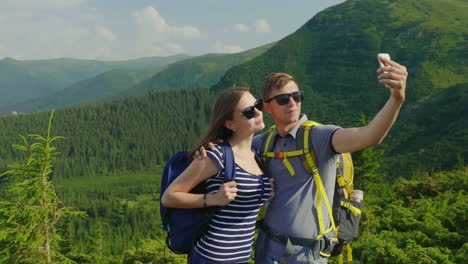 a happy couple of tourists photographed themselves smiling at the camera against the background of a