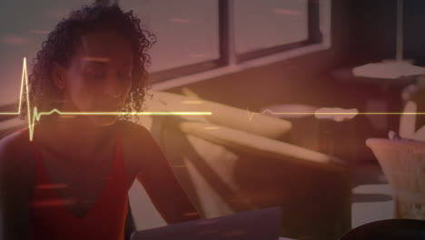 animation of lifeline over women using laptop