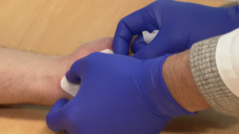 applying a bandage to a wound