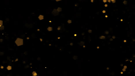 Bokeh-shining-colorful-particles.-Shimmering-Glittering-Particles-loop-animation-with-black-background