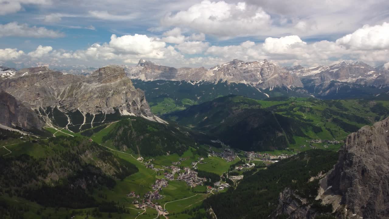 Colfosco village in Alta Badia, surrounded by lush valleys and towering Dolomite peaks