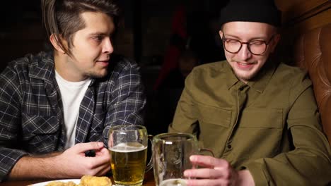 friends enjoying drinks and conversation at a pub