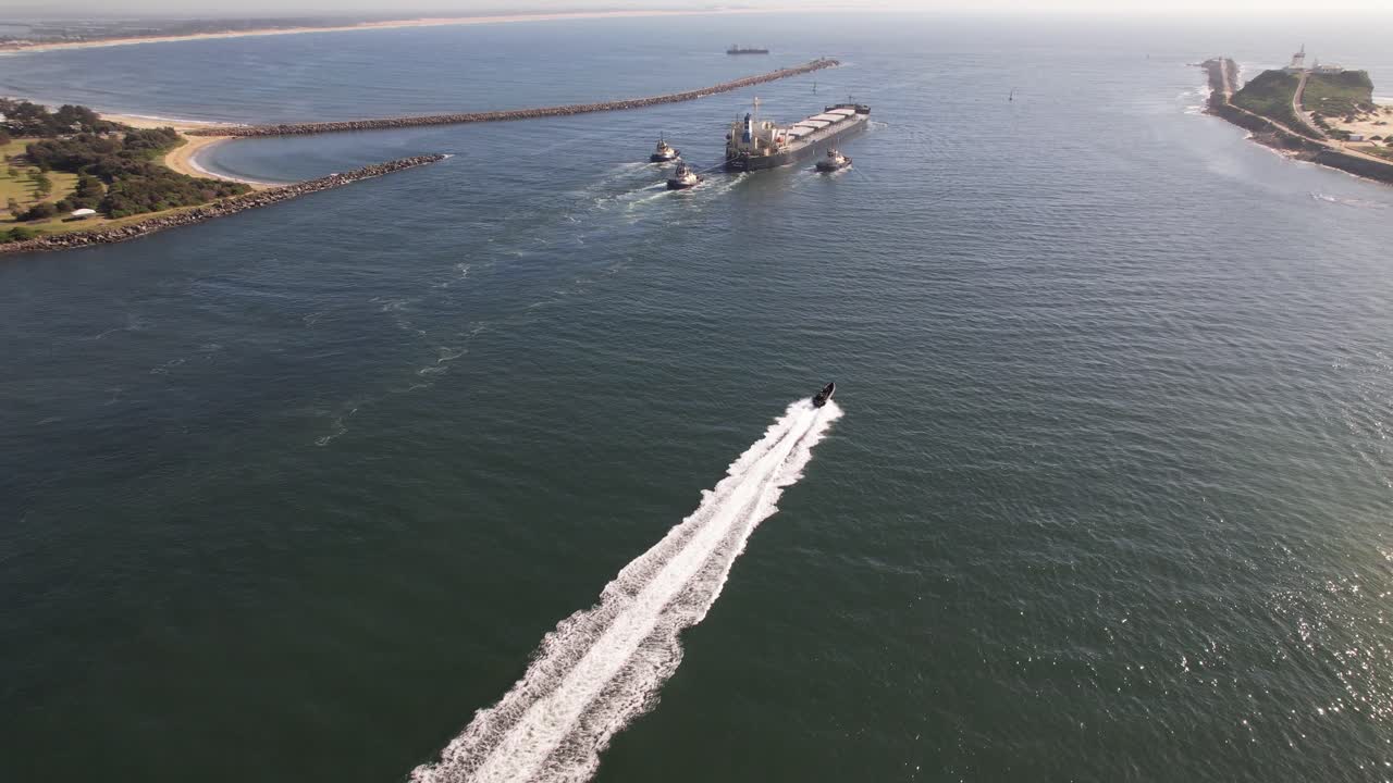 Motorboat Cruising In Hunter River Towards The Sea In Newcastle, NSW, Australia. - aerial shot