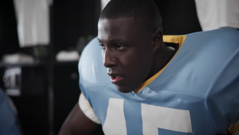 upset football player in locker room