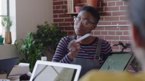 creative team of engineers using tablet computer designing bicycle prototype african american business woman presenting design on screen planning project sharing ideas in office meeting