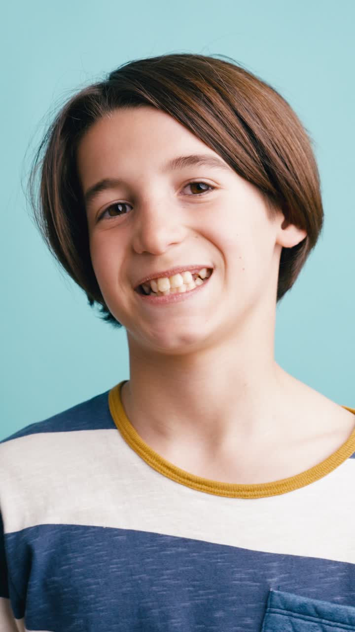 Young Boy Smiling and Laughing in a Studio