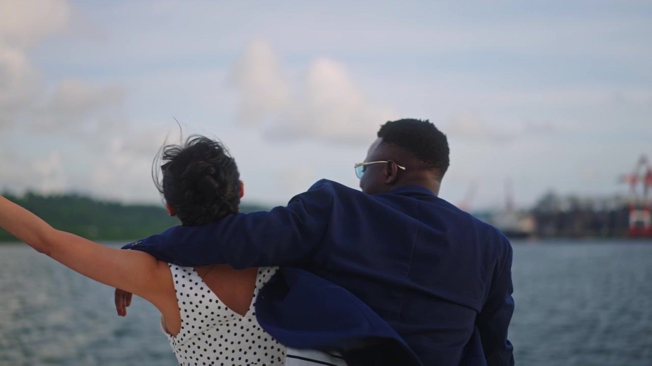 Couple experiencing an upscale ocean vacation with scenic surroundings and a romantic atmosphere.