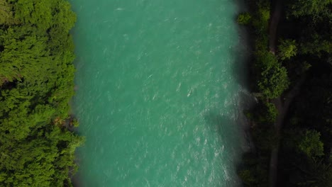 Aerial-of-a-river-surrounded-by-forest