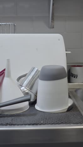 kitchen utensils drying on counter