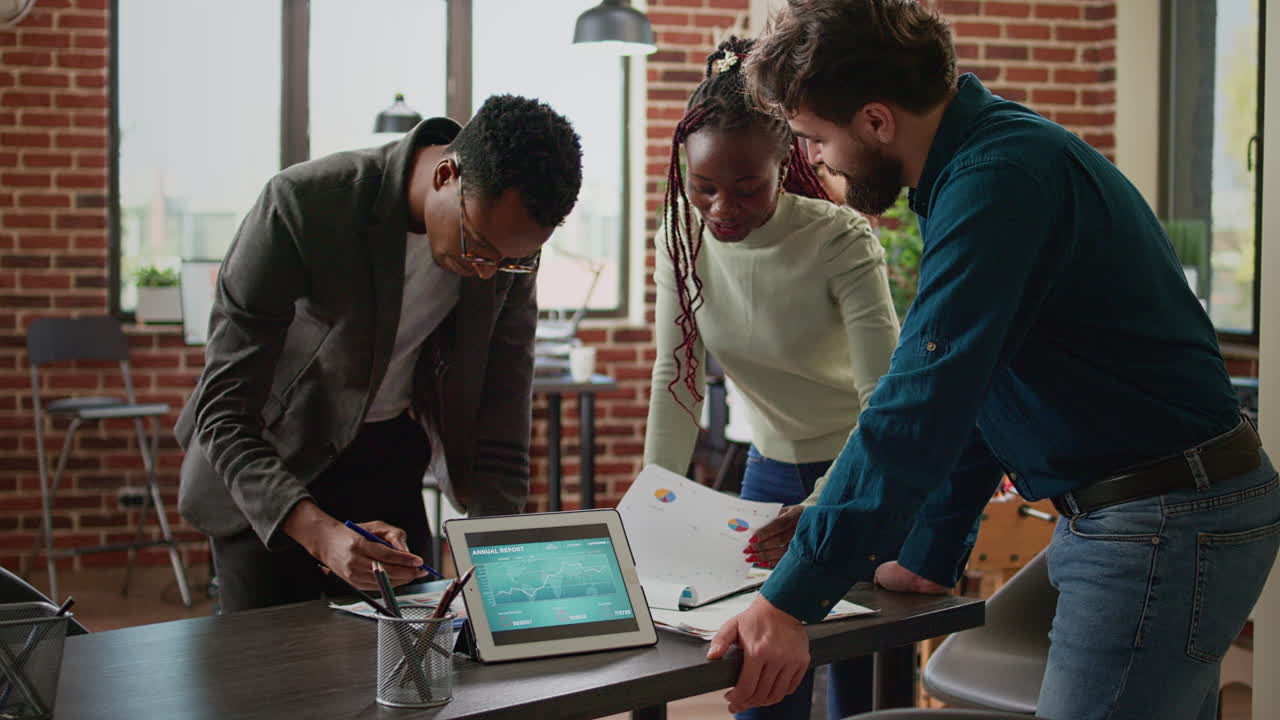 Diverse group of coworkers planning research analysis in business office