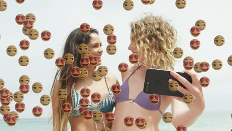 emojis over women taking selfies.