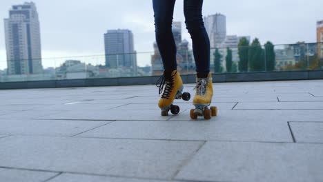 woman legs making steps on rollerblades outside. roller skater riding outdoor.