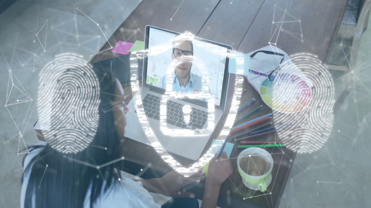 Person using laptop for video call with digital security animation overlay