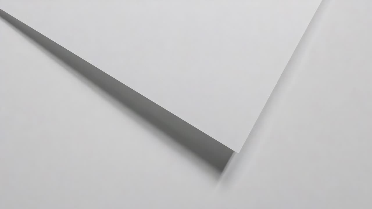Panning camera showing large white panel sliding right on tabletop, revealing gap, emphasizing edge