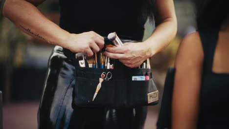 makeup artist preparing tools