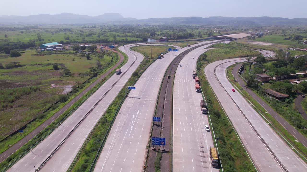Igatpuri Interchange on Samruddhi Mahamarg through green corridors western ghats landscape, Igatpuri Kasara tunnel in background, Maharashtra, drone shot