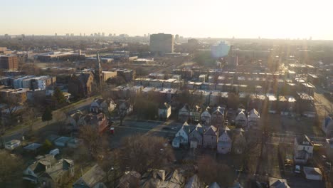 drone reveals houses in low income neighborhood at sunrise