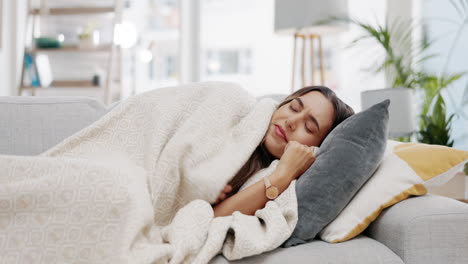 sick woman, blanket and flu on sofa from cold