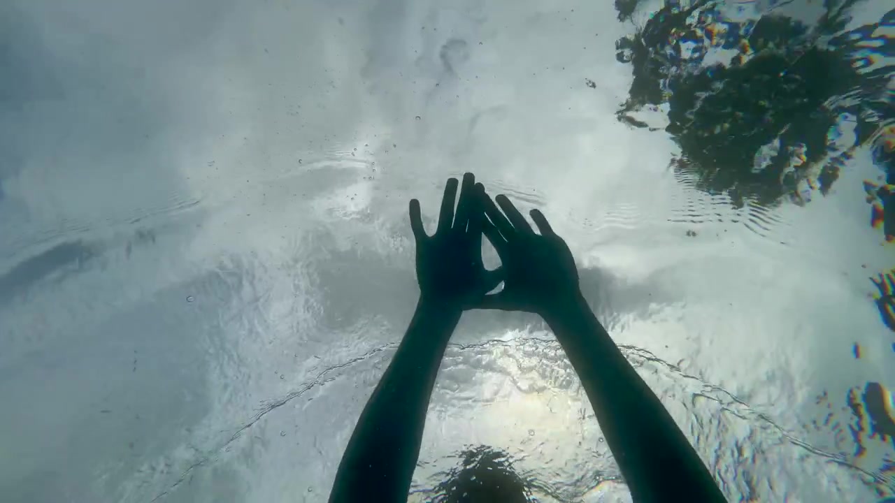 Underwater View of Person Swimming in Pool