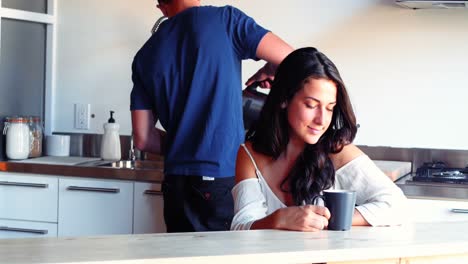 couple having coffee in kitchen