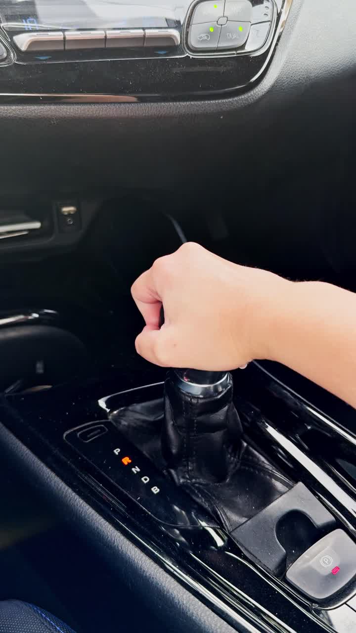 A person is driving a car and is pressing the gas pedal.