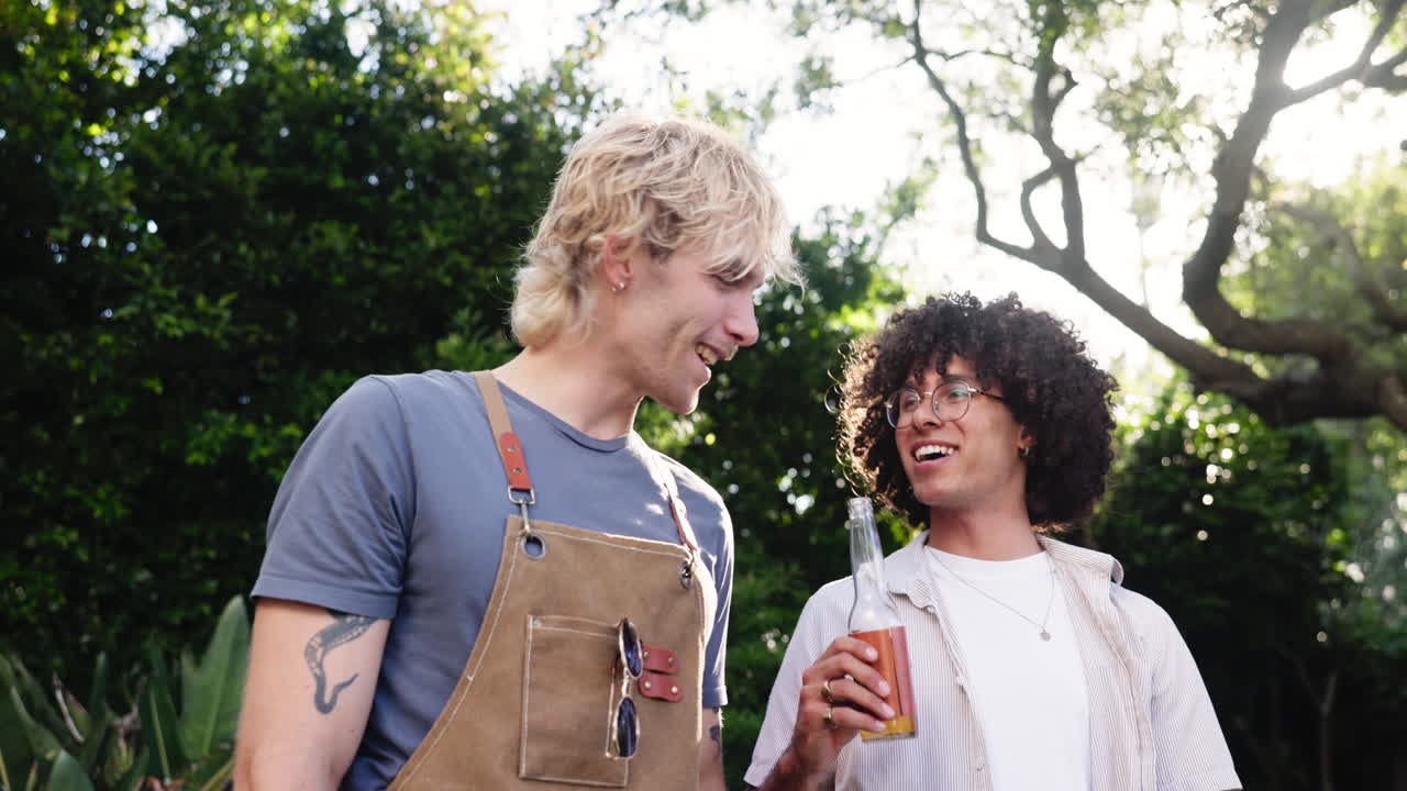 Two Happy Young Men Talking and Laughing Outdoors