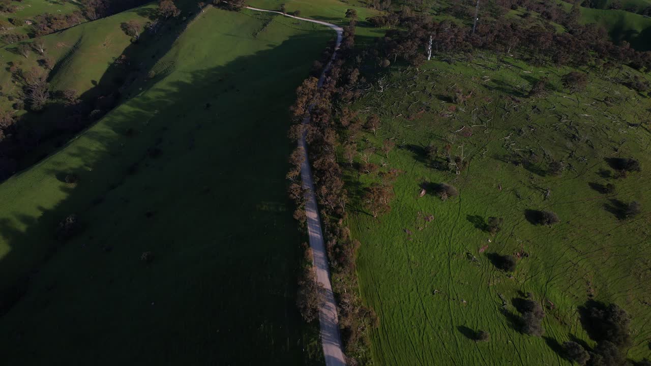 Mountain Road Through The Green Field In Rifle Range Lookout, Bethany, South Australia - Drone Shot