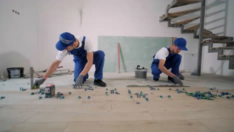 installing ceramic floor tiles - measuring and cutting the pieces. construction, renovation, repair apartment. cuts tile. tile cutting