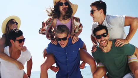 Group-of-friends-enjoying-on-beach