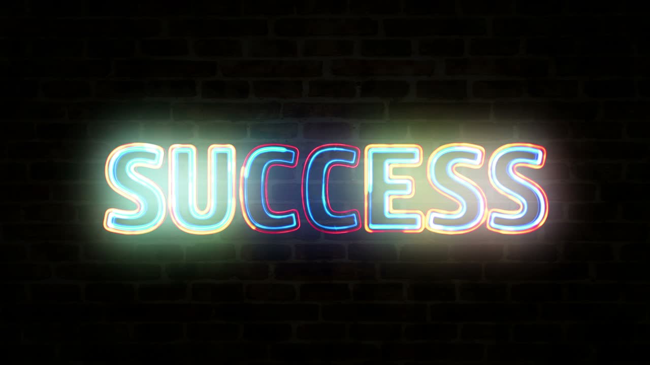 Success neon on brick wall