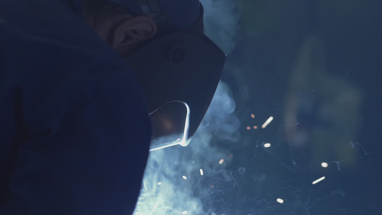 Close up of a welder using MIG welding procedure.